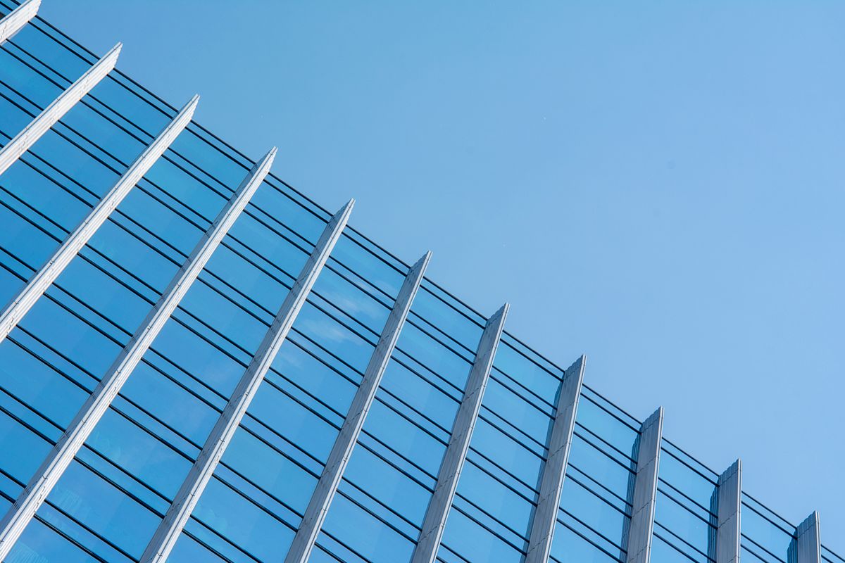 A modern civic building against a blue sky